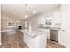 Open concept features kitchen island with sink, modern cabinetry, and easy access to living space at 237 Hopewell Branch Ct, Smithfield, NC 27577