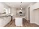 Modern kitchen features a granite island, stainless steel appliances, and ample cabinet space at 237 Hopewell Branch Ct, Smithfield, NC 27577