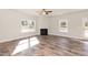 Cozy living room features a classic fireplace, lots of natural light, and a ceiling fan at 237 Hopewell Branch Ct, Smithfield, NC 27577