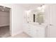 Bright main bathroom features a double sink vanity and a walk-in shower at 237 Hopewell Branch Ct, Smithfield, NC 27577