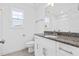 Clean bathroom with single vanity and granite countertop at 250 Eason Creek Way, Clayton, NC 27527