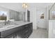 Modern bathroom with double vanity and granite countertops at 250 Eason Creek Way, Clayton, NC 27527