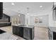 Open concept kitchen with island and stainless steel appliances at 250 Eason Creek Way, Clayton, NC 27527