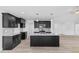 Modern kitchen with granite countertops and dark cabinetry at 250 Eason Creek Way, Clayton, NC 27527