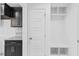 Convenient laundry area with built-in shelving and cabinets at 250 Eason Creek Way, Clayton, NC 27527