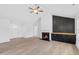 Living room featuring a fireplace and built-in shelving at 250 Eason Creek Way, Clayton, NC 27527