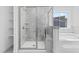Large walk-in shower with marble tile and built-in shelving at 250 Eason Creek Way, Clayton, NC 27527