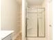 Bathroom shower with glass doors and tile surround at 251 Hopewell Br Ct, Smithfield, NC 27577
