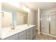 Primary bathroom featuring double vanity and glass shower at 251 Hopewell Br Ct, Smithfield, NC 27577