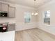 Bright dining area featuring modern finishes and two windows at 251 Hopewell Br Ct, Smithfield, NC 27577