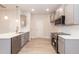 Modern kitchen featuring stainless steel appliances and gray cabinets at 251 Hopewell Br Ct, Smithfield, NC 27577