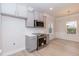 Well-lit kitchen with gray cabinets and stainless steel appliances at 251 Hopewell Br Ct, Smithfield, NC 27577