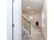 Bright living room boasts fireplace and hardwood floors leading to carpeted stairs at 251 Hopewell Br Ct, Smithfield, NC 27577