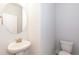 Cozy powder room with a pedestal sink and modern fixtures at 251 Hopewell Br Ct, Smithfield, NC 27577