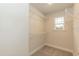 Walk-in closet features carpeted floors, a window for natural light, and built-in wire shelving at 251 Hopewell Br Ct, Smithfield, NC 27577
