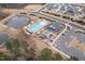 Aerial view of community pool, playground and amenity center, offering residents leisure and recreation at 2515 Impulsion Dr, New Hill, NC 27562