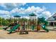 Community playground with slides and play structures provides outdoor fun for families at 2515 Impulsion Dr, New Hill, NC 27562