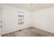 Bright bedroom with carpeted floor and a large window at 257 Cambridge Elm Dr, Clayton, NC 27520