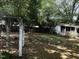 The expansive backyard features a gazebo and privacy fence at 2612 Academy St, Sanford, NC 27332