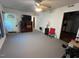 Bright living room featuring ceiling fan and access to other rooms at 2612 Academy St, Sanford, NC 27332