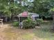 Exterior of a screened-in pavilion with Coca-Cola sign and surrounding landscaping at 2612 Academy St, Sanford, NC 27332