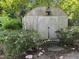 Exterior of a small shed with double doors surrounded by landscaping at 2612 Academy St, Sanford, NC 27332