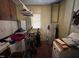 Utility room with cabinets and water heater at 2612 Academy St, Sanford, NC 27332