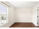 Bedroom featuring a large window offering bright light and view of the exterior of the property at 30 Cheltenham Dr, Clayton, NC 27520