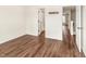 Bedroom with hardwood floors, neutral walls, and multiple doorways providing access to the rest of the home at 30 Cheltenham Dr, Clayton, NC 27520
