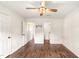 Bedroom with hardwood floors and access to other rooms in the home at 30 Cheltenham Dr, Clayton, NC 27520