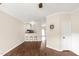 Bright kitchen with bar stool seating flowing into an open and airy living room at 30 Cheltenham Dr, Clayton, NC 27520