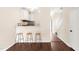 Modern kitchen with bar stool seating and updated appliances at 30 Cheltenham Dr, Clayton, NC 27520