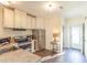 Modern kitchen with stainless steel appliances and white cabinets at 30 Cheltenham Dr, Clayton, NC 27520