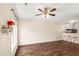 Open living area with modern flooring flows into the kitchen, enhanced by bright light at 30 Cheltenham Dr, Clayton, NC 27520