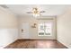 Inviting living room with hardwood floors and ample natural light coming through the window at 30 Cheltenham Dr, Clayton, NC 27520