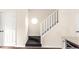 Open stairway with white railing and entry to doors at 30 Cheltenham Dr, Clayton, NC 27520