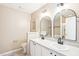 Elegant bathroom with double vanity and arched mirrors at 3526 Londonville Ln, Raleigh, NC 27604