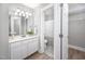 Clean bathroom with white vanity, mirror, and a shower/tub combo at 3805 Chimney Ridge Pl # 008, Durham, NC 27713