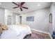 Spacious bedroom with ceiling fan, neutral walls, and ample closet space at 3805 Chimney Ridge Pl # 008, Durham, NC 27713