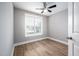 Well-lit bedroom with ceiling fan and window with blinds at 3805 Chimney Ridge Pl # 008, Durham, NC 27713