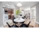 Open concept dining area with kitchen and living room views, perfect for entertaining at 3805 Chimney Ridge Pl # 008, Durham, NC 27713
