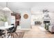Kitchen and dining area with white table and four black chairs at 3805 Chimney Ridge Pl # 008, Durham, NC 27713