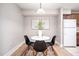 Cozy dining area with a round table and four black chairs at 3805 Chimney Ridge Pl # 008, Durham, NC 27713