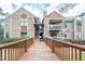 Front view of building with walkway and parking at 3805 Chimney Ridge Pl # 008, Durham, NC 27713