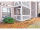Ground level view of building exterior with screen porch at 3805 Chimney Ridge Pl # 008, Durham, NC 27713