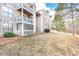 Rear view of building showing multiple units and landscaping at 3805 Chimney Ridge Pl # 008, Durham, NC 27713