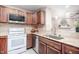 Updated kitchen with stainless steel appliances and wood cabinets at 3805 Chimney Ridge Pl # 008, Durham, NC 27713