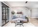 Living room with hardwood floors, sofa, and access to a patio at 3805 Chimney Ridge Pl # 008, Durham, NC 27713