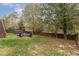 Spacious backyard includes a hot tub, seating, and a firepit at 3905 Song Sparrow Dr, Wake Forest, NC 27587