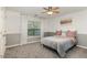 Bedroom with plush carpeting, a window with natural light, and soft gray color palette at 3905 Song Sparrow Dr, Wake Forest, NC 27587